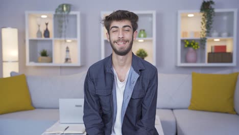 Man-smiling-at-camera